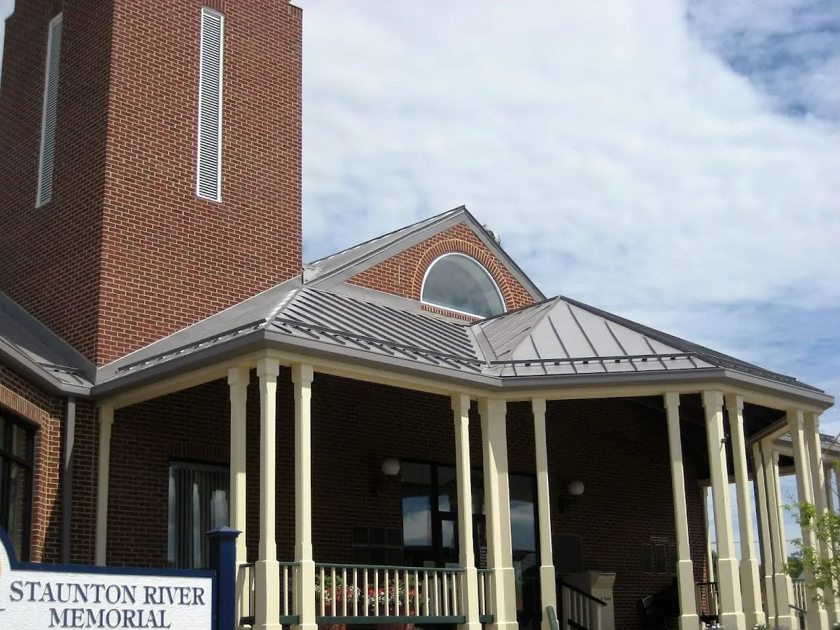 Skilled roofing craftsmen working on a residential roof in Newport